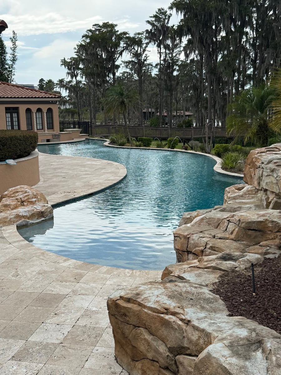 Stunning lagoon-style pool with natural rock features in Central Florida