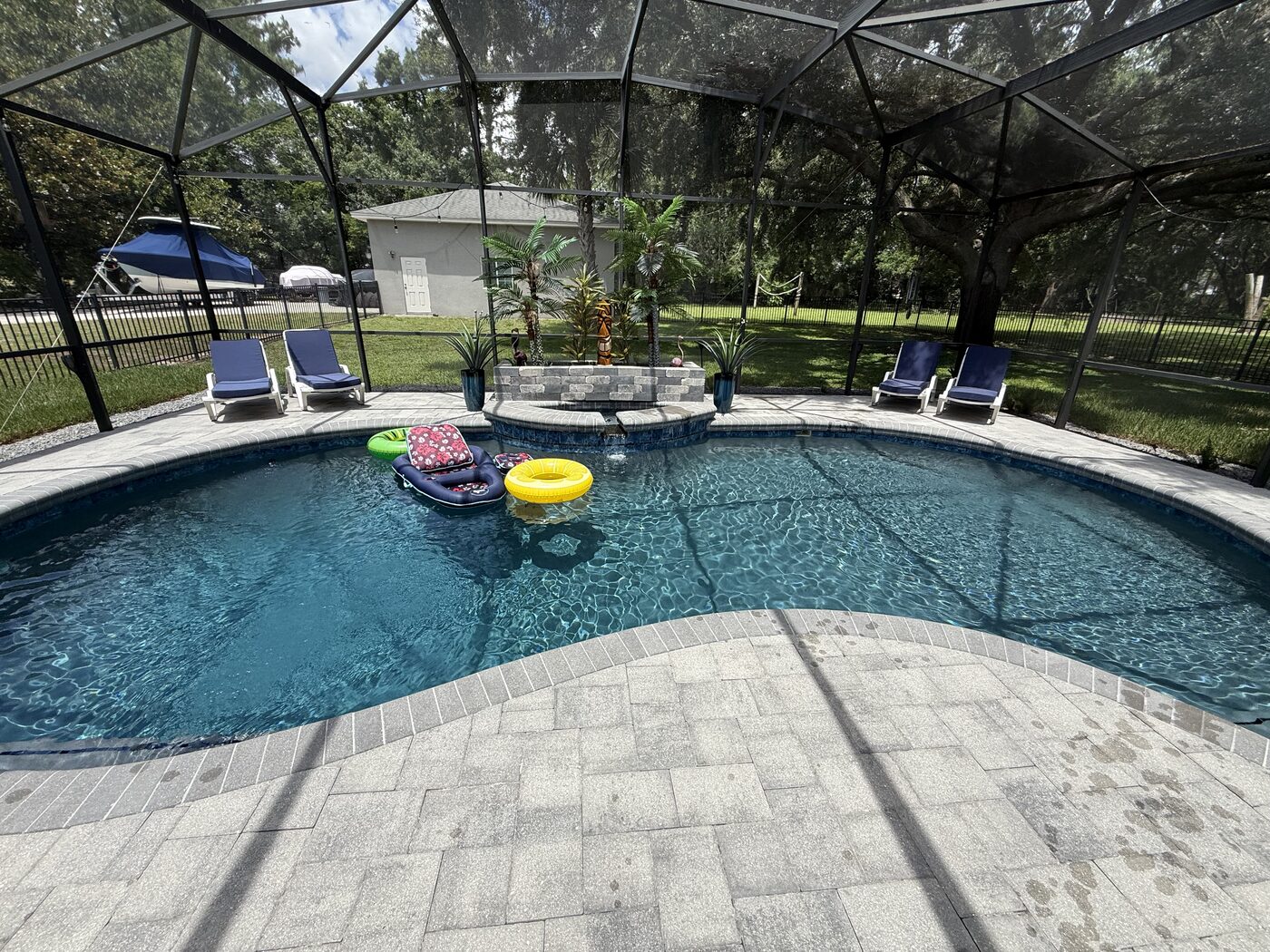 Beautiful backyard pool we care for weekly